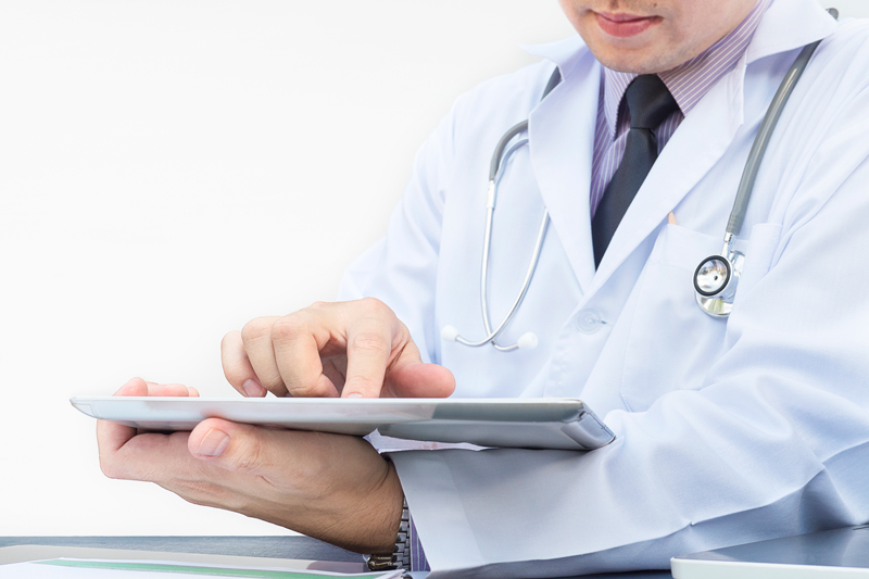 doctor-is-working-with-tablet-white-background