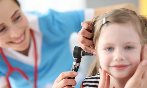 female-doctor-conducts-medical-examination-ear-with-otoscope-little-girl