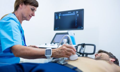 man-getting-ultrasound-abdomen-from-doctor