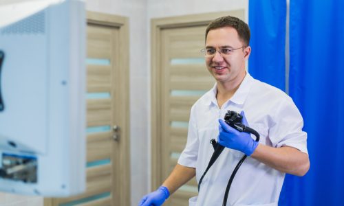 proctologist-holding-anoscope-at-hospital-ward-2021-08-26-15-53-02-utc